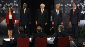 GOP presidential candidates meet at a forum in South Carolina Monday. From left to right, Rep. Michele Bachmann, businessman Herman Cain, former House Speaker Newt Gingrich, Rep. Ron Paul and former Mass. Gov. Mitt Romney. Texas Gov. Rick Perry was not at the event.