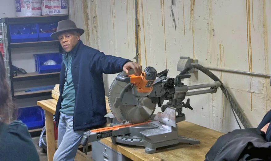 Instructor Darryl Neal poses with a circular saw used as part of the bridge program’s construction fundamentals section during a tour of the Climate and Equitable Jobs Act Waukegan hub on Feb. 27, 2026.