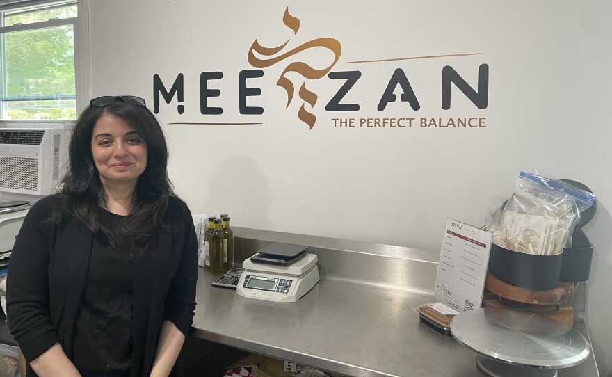 Layla Khafaga, owner of Meezan Kitchen standing in her commercial kitchen in her Niskayuna home