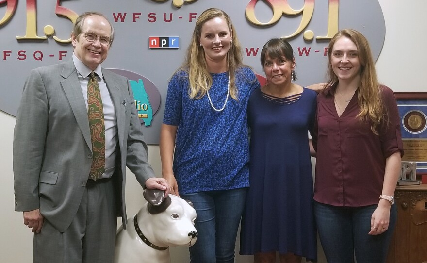 Tom and three guests standing in the fm lobby