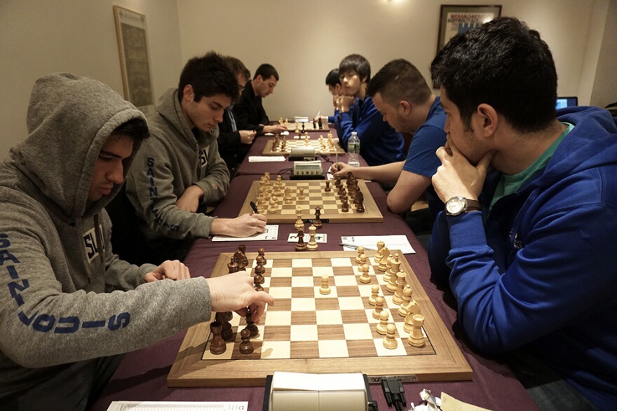 The Saint Louis University chess team engaged in chess matches with the Webster University team.