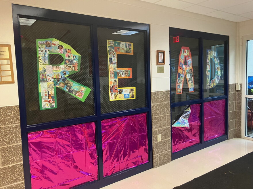 Longfellow's emphasis on reading near the entrance of the school, 4198 7th Ave., Rock Island.
