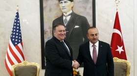U.S. Secretary of State Mike Pompeo shakes hands with Turkish Foreign Minister Mevlut Cavusoglu before their official talks in Ankara, Turkey, on Wednesday.