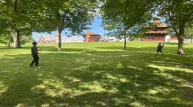 Wyandotte Citizen Caleb Garcia plays lacrosse with a visitor at the Fort Recovery Museum and Monument in Mercer County.