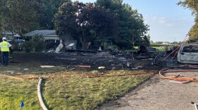 A destroyed home on Old Peoria Court in Bloomington is seen Wednesday morning, Aug. 26, 2026. Nicor crews were at work on the left.