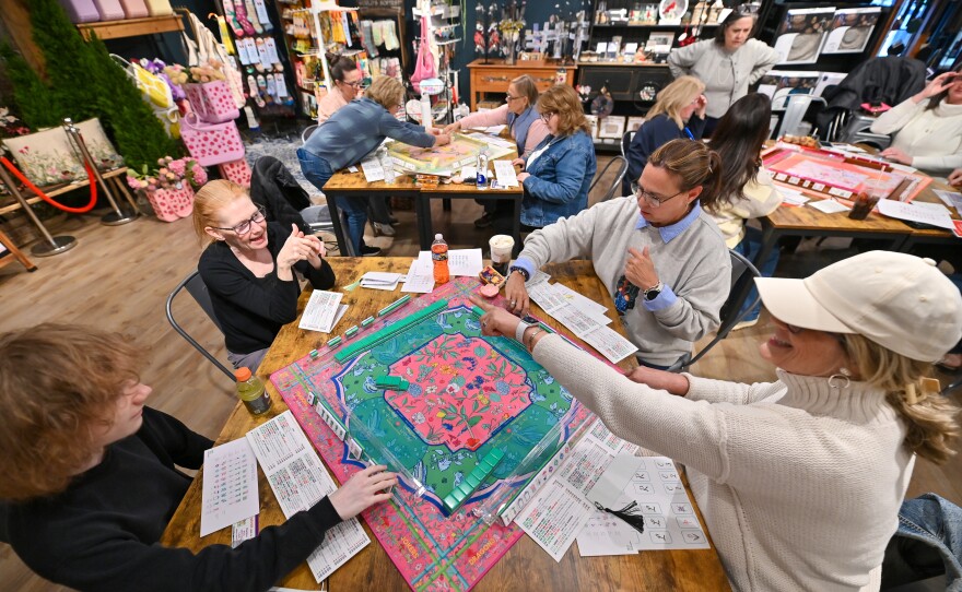 A group learns the game of mah-jongg at Corky's Garden Path in Scott Twp.