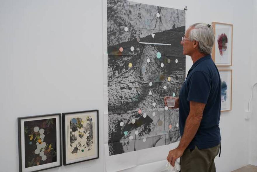 A visitor views art at Collective 62, an all-female artist studio complex in Liberty City.