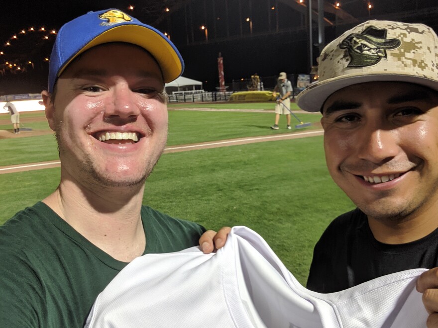 David Edwards (left) and Ray Hernandez, manager of the Quad City River Bandits.