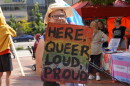 Rally supporters holding signs.