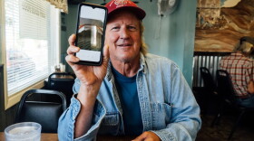  Kevin Connor shows a photo of his housing at one point – a tent in the back of a storage room with an inflatable mattress.