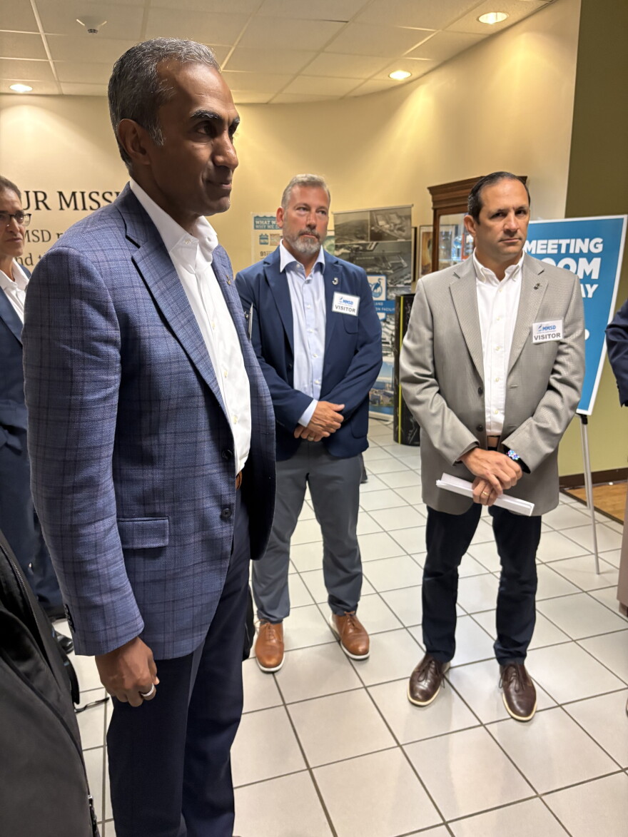Jacobs Engineering CEO Bob Pragada (left) after MMSD commission voted unanimously to award his company next 10-year contract.