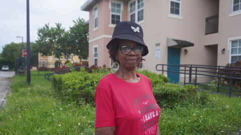 North Park at Scott Carver resident Caprice Brown stands in front of the Liberty City apartment complex. Brown has lived at the property for 13 years and has raised concerns about living conditions and management practices at the development.