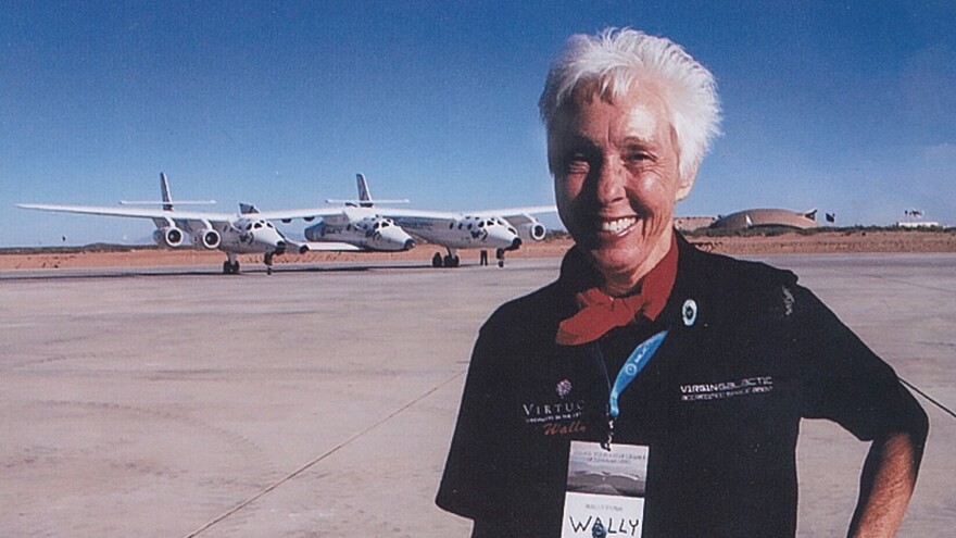 Wally Funk poses in front of the Virgin Galactic spacecraft in 2015 in the Mojave Desert. Funk has a ticket and hopes to be on its first flight into space.