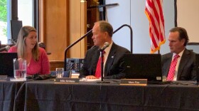 Gaming Commission Executive Director Sara Gonso Tait, left, discusses new gaming policies with commission members.