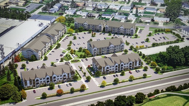 An aerial view shows an artist's rendering of an apartment complex