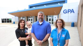 From left, Glasgow Preschool Academy Principal Yvonne Wilkinson holds her daughter, Leighton, alongside district Superintendent Chad Muhlenkamp and Director of Special Education Belinda West. Teachers and administrators will welcome all district 4-year-olds, not just those who qualify, into Glasgow Preschool Academy this fall through Governor Andy Beshear's universal Pre-K pilot program.