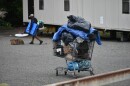 Residents of a homeless encampment behind a Gastonia church move out their belongings on Aug. 28, 2023.