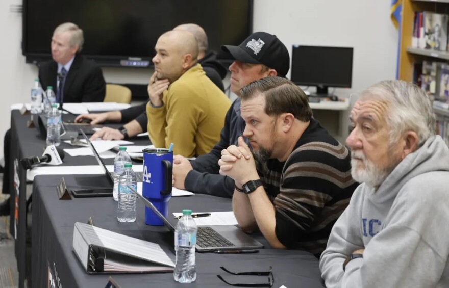 Members of the Coweta School Board listen to citizens after YouTuber Ron Durbin aired allegations of widespread sexual assault.
