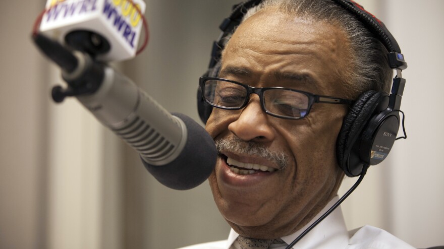 Rev. Al Sharpton smiles during his radio show "Keeping It Real with Reverend Al Sharpton" in New York.