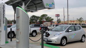 A Nissan LEAF charging at a station in Houston, Texas, that has both DC fast chargers and lower-level chargers.