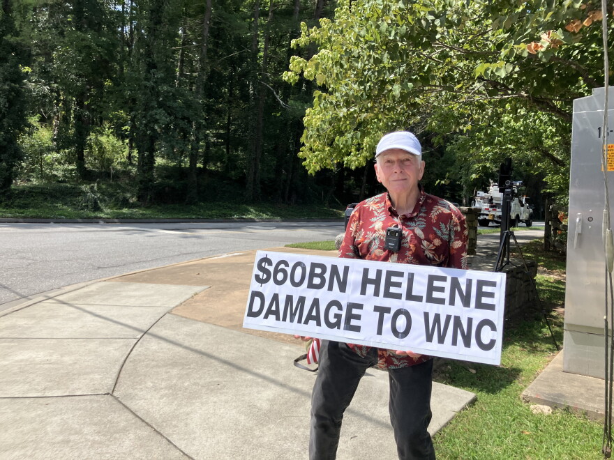 Tom Sullivan, also known as the Asheville Sign Guy, demonstrates on Merrimon Avenue in Asheville Saturday, August 29, 2026.