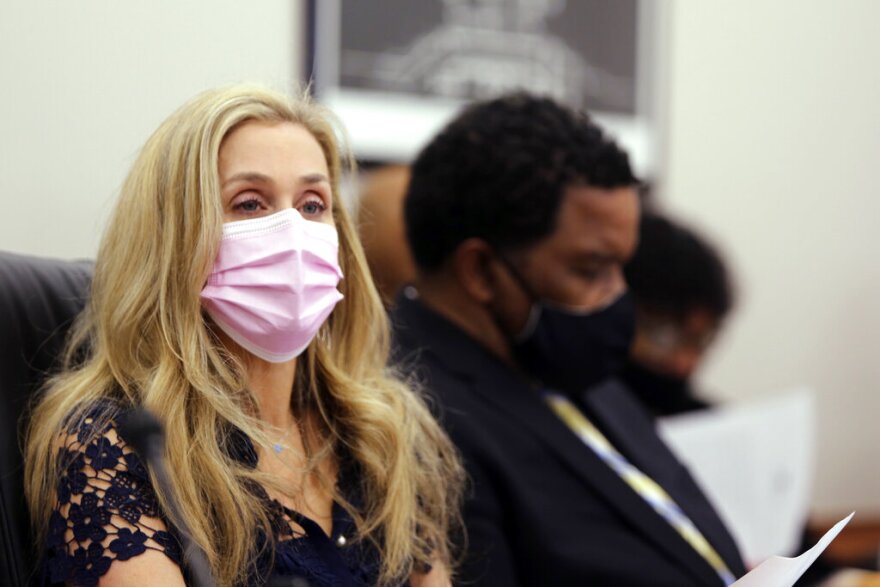 South Carolina state Rep. Beth Bernstein, D-Columbia, left, and Rep. Wendell Gillard, D-Charleston, right, listen to a Senate hearing about a hate crime bill they both sponsored, Wednesday, April 21, 2021, in Columbia, S.C. The Senate is considering the hate crime bill passed in April by the House. (AP Photo/Jeffrey Collins)