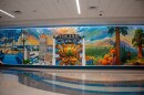 The floor-to-ceiling mural, titled “Fresno Airport: A Welcoming Adventure,” was painted by two local artists.