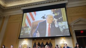 An image of former President Donald Trump is seen as the House Select Committee to Investigate the January 6 Attack on the U.S. Capitol holds its last public meeting in the Canon House Office Building on Capitol Hill in Washington, DC.