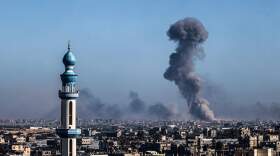 A picture taken from Rafah shows smoke billowing during Israeli bombardment over Khan Yunis in the southern Gaza Strip on Feb. 11, 2024, amid the ongoing conflict between Israel and the Palestinian Hamas militant group. (Said Khatib/AFP via Getty Images)