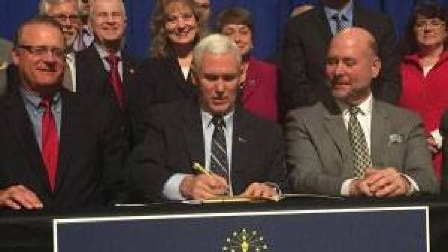 Gov. Mike Pence Thursday signed two bills that curb negative consequences for teachers and schools from last yearâ€™s low ISTEP+ scores.
