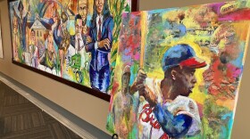 Preston Sampson's Hank Aaron painting (right, done in 2015), stands next to his permanent Quad Cities mural at Modern Woodmen Park's Diamond Club, March 26, 2026.