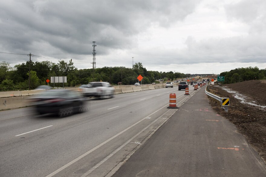 Traffic goes eastbound on Texas 71.