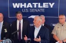 GOP U.S. Senate candidate Michael Whatley speaks at a podium in Harrisburg.