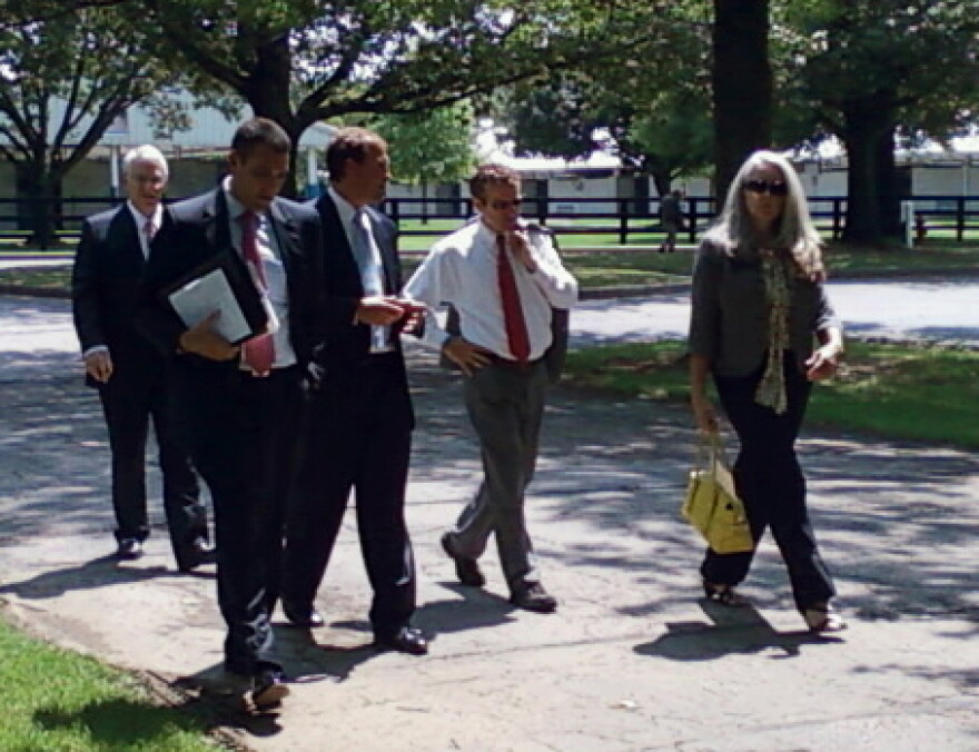 Senator Rand Paul walks and talks with aids after a speech to the Rotary Club of Lexington.