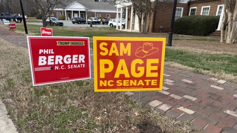 Sheriff Sam Page leads Phil Berger by two votes in N.C. Senate District 26 after election day ballots were tallied. This photo shows campaign signs for the two candidates outside of a polling place in Jamestown on Tuesday, March 3.