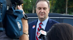 St. Louis County Executive Sam Page speaks with TV reporters early Tuesday morning, Aug. 4, 2020, after voting at the First Church of Christ Scientist in Creve Coeur.
