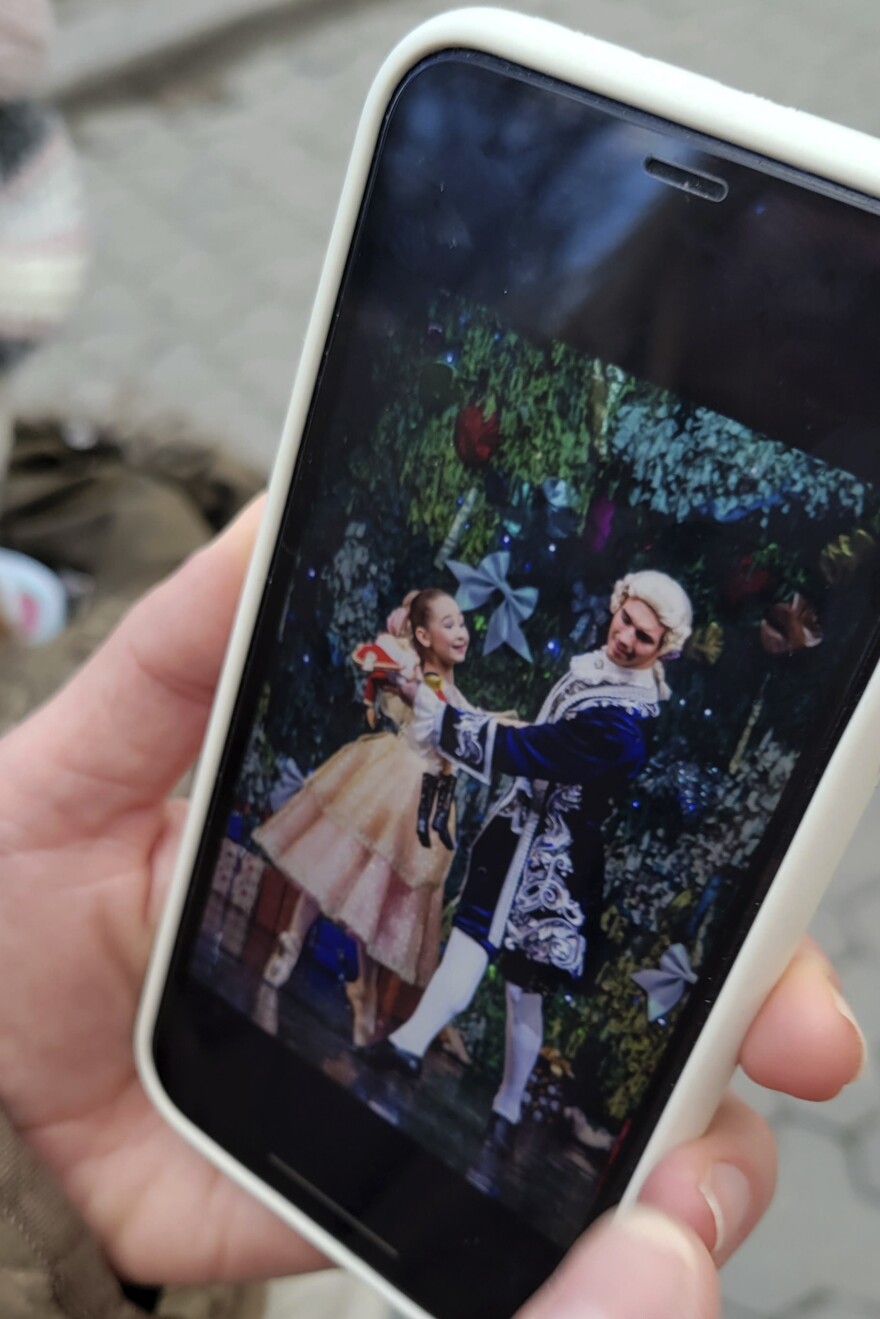 Kateryna Klevtsova shows a picture on her phone of her older daughter Maria in a lavish production last Christmas of <em>The Nutcracker.</em>