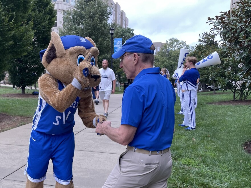 UK President Dr. Eli Capilouto, mascot Scratch and cheerleaders welcome back students during Big Blue Move In in 2024.