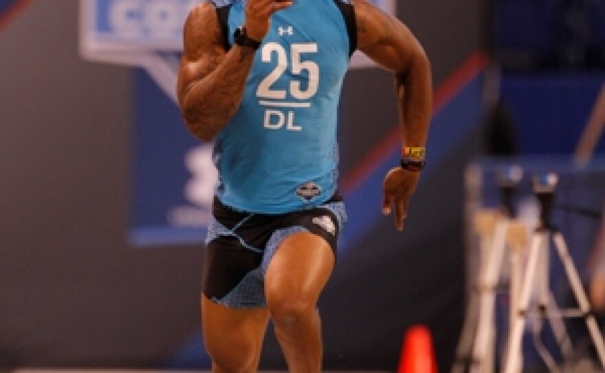 Fast, with a past: West Virginia defensive lineman Bruce Irvin runs a drill at the NFL football scouting combine in Indianapolis on Monday, Feb. 27, 2012.