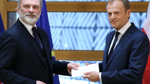 British Ambassador to the EU Tim Barrow (left) delivers Prime Minister Theresa May's formal notice of the U.K.'s intention to leave the bloc to European Council President Donald Tusk in Brussels on Wednesday.