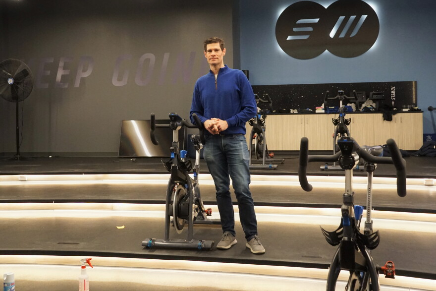 Bob Koplar stands in his empty indoor cycling studio, Steel Wheels, which he shuttered late spring.