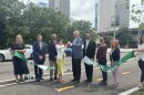 Mayor Cara Spencer and Greater St. Louis Chief Downtown Officer Kurt Weigle cut the ribbon announcing the debut of improvements to 7th Street in downtown St. Louis.