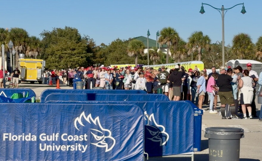 President Trump's supporters wait to enter Alico Arena for his latest campaign rally in advance of the 2026 midterm elections.
