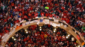 FILE - Protestors of Wisconsin Gov. Scott Walker's bill to eliminate collective bargaining rights for many state workers pack the rotunda at the State Capitol Feb. 17, 2011, in Madison, Wis. (AP Photo/Andy Manis, File)