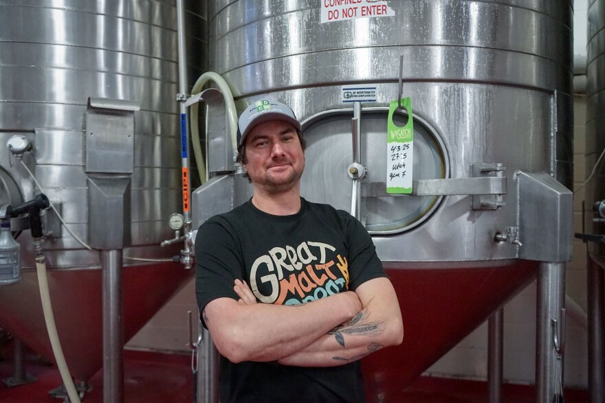 Nils Imboden, director of operations for Salt Lake Brewing Co. and Top of Main, stands in front of a fermentation vessel, April 24, 2025.