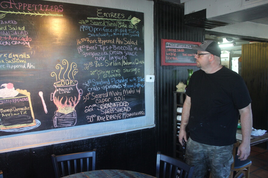 Shells owner Heber Stone goes over the night's menu of available entrees.