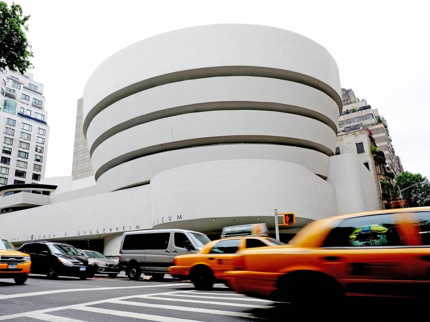The Guggenheim Museum, designed by Frank Lloyd Wright who developed the concept of "organic architecture," that a building should develop out of its surroundings. [Stan Honda / AFP/Getty Images]