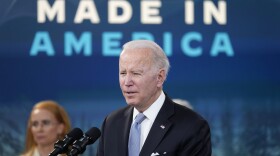 President Joe Biden speaks about domestic manufacturing and electric vehicle chargers while accompanied by Tritium CEO Jane Hunter in the South Court Auditorium in the Eisenhower Executive Office Building on the White House complex, Tuesday, Feb. 8, 2022, in Washington.