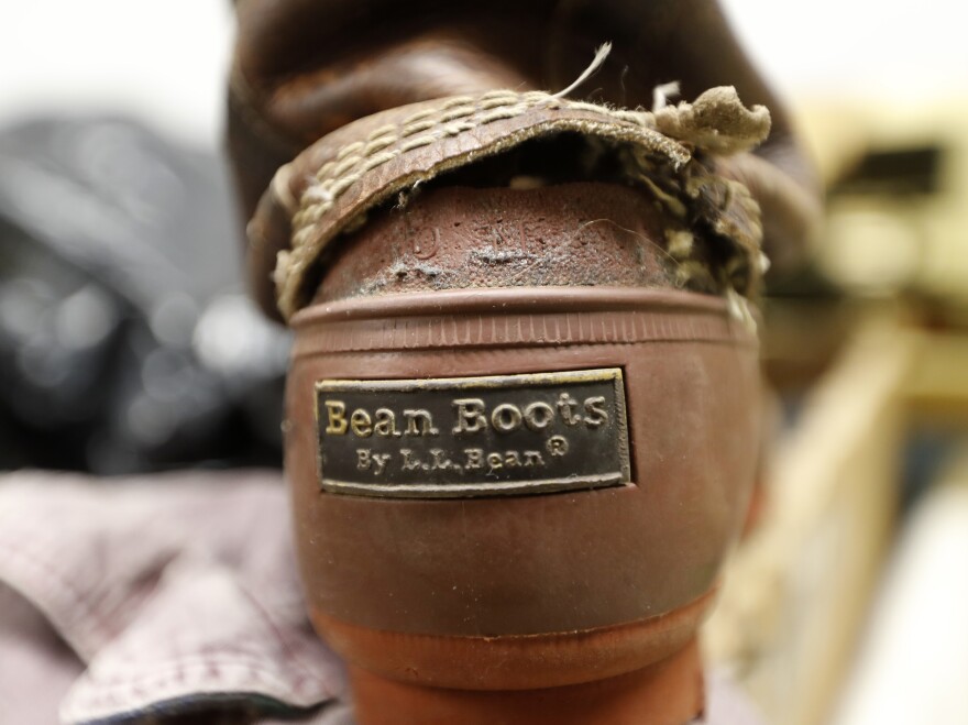 A Bean Boot is seen in the return bin at an L.L. Bean retail store in Freeport, Maine.