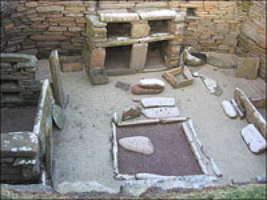 The stone village of Skara Brae was built approximately  5,000 years ago.  Each house has a large square room with a fireplace, two beds, and a dresser with shelves.